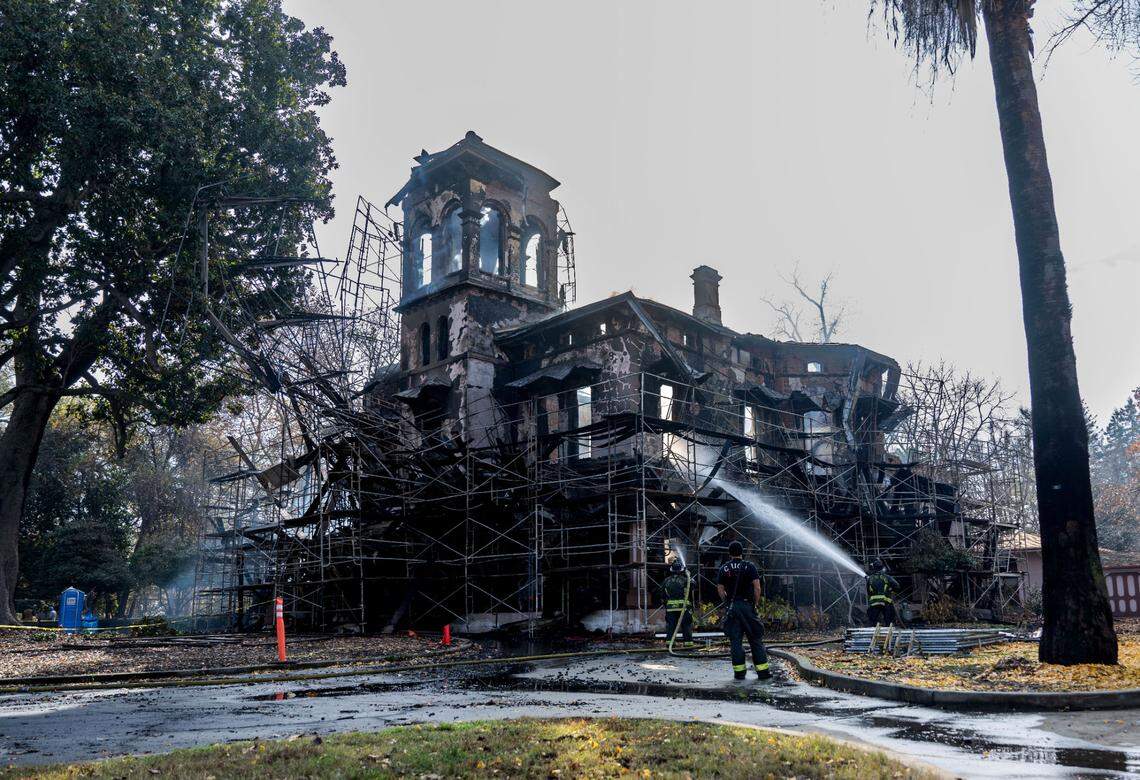 Chico firefighters work to put out hot spots on Wednesday, Dec. 11, 2024, after the city’s historic Bidwell Mansion burned overnight.