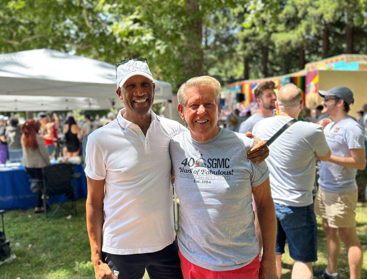 Steven Winlock, left, and Dennis “Denny” Mangers smile at the Sacramento Gay Men’s Chorus 40th anniversary concert at Southside Park Sunday, May 25, 2025. The two men were founding members of the group, which was created in 1984.