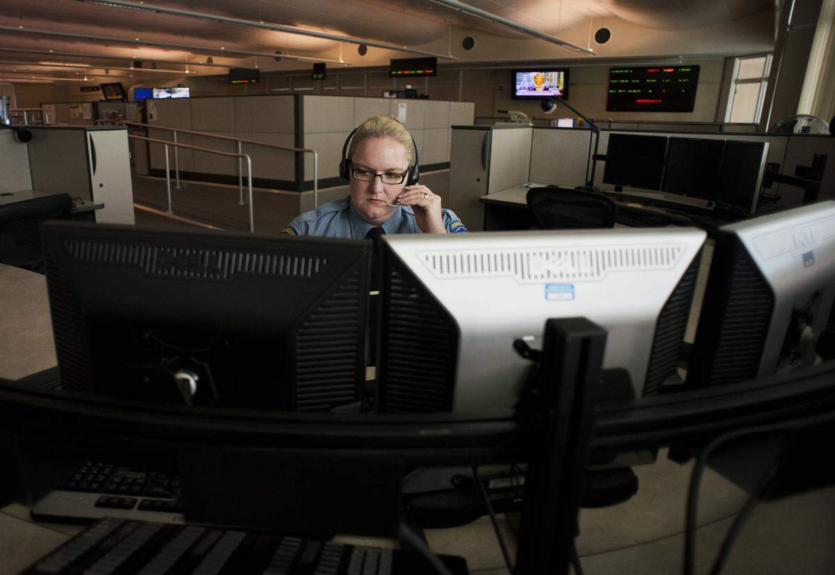 Sacramento Police Dispatcher II Sarah Kern receives emergency calls at Sacramento Police Communication Center in 2013.