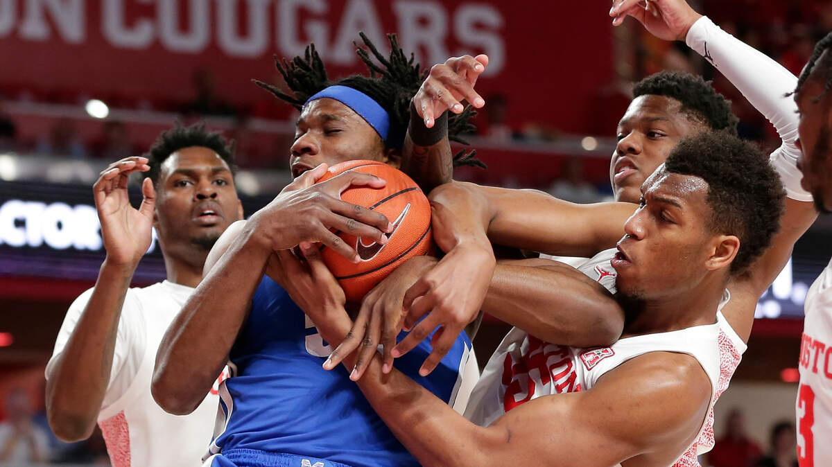 Memphis forward Precious Achiuwa, left middle, wrestles for a rebound. The Sacramento Kings could draft him with the No. 12 pick next month.