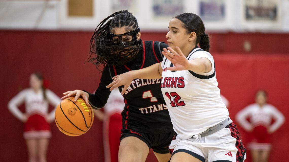 McClatchy Lions' Jaliyah Cooper (12) defends the Antelope Titans' Kamaria Charlo (4) in the second half of a game on Friday, Jan. 9, 2026, in Sacramento.