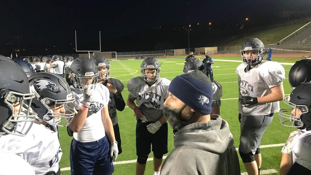 Vista del Lago coach Mike Struebing addresses his team during a practice.