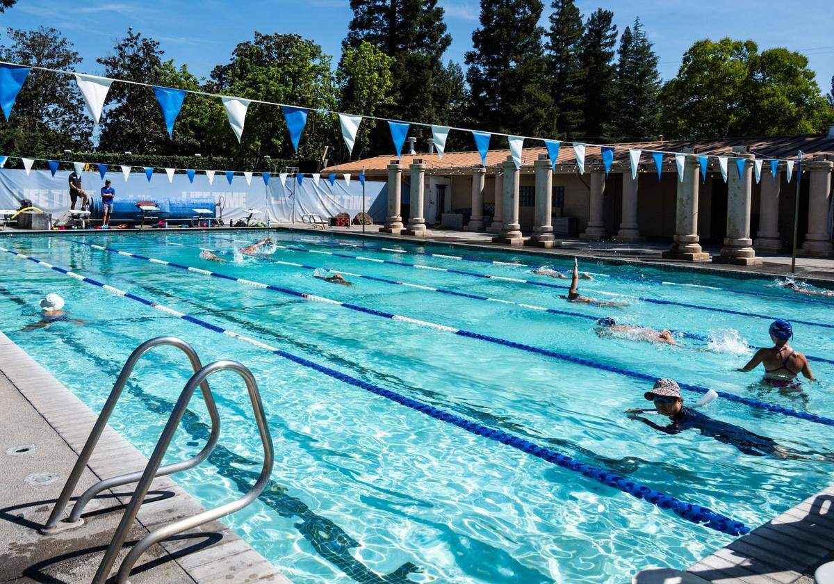 Swimmers try out the pool at Life Time Arden on June 26, 2025, the day before its grand opening. 