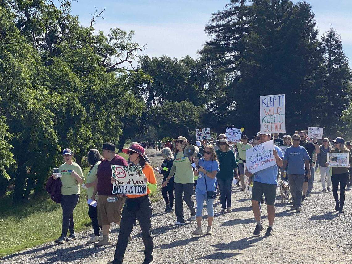 Hundreds of people protest along the American River Parkway on Sunday, May 4, 2025, against a plan by the U.S. Army Corps of Engineers to remove hundreds of trees for erosion control to safeguard against a levee failure.