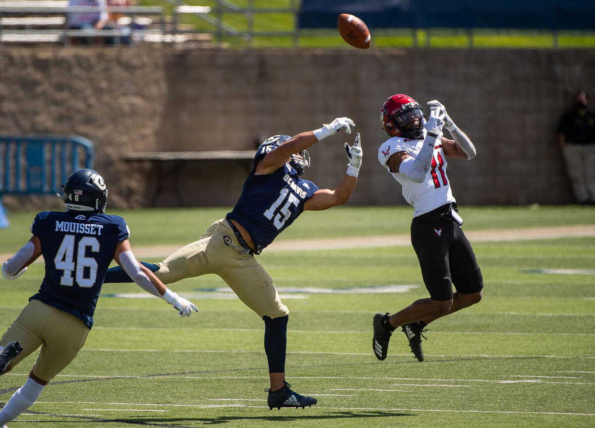 UC Davis Aggies linebacker Teddye Buchanan (15) breaks up a pass intended for Eastern Washington Eagles wide receiver Freddie Roberson (11) during the second quarter of the college football game Saturday, April 3, 2021, at UC Davis Health Stadium. Buchanan, who went on to play at Cal, was drafted Saturday by the Baltimore Ravens in the fourth round of the NFL draft.