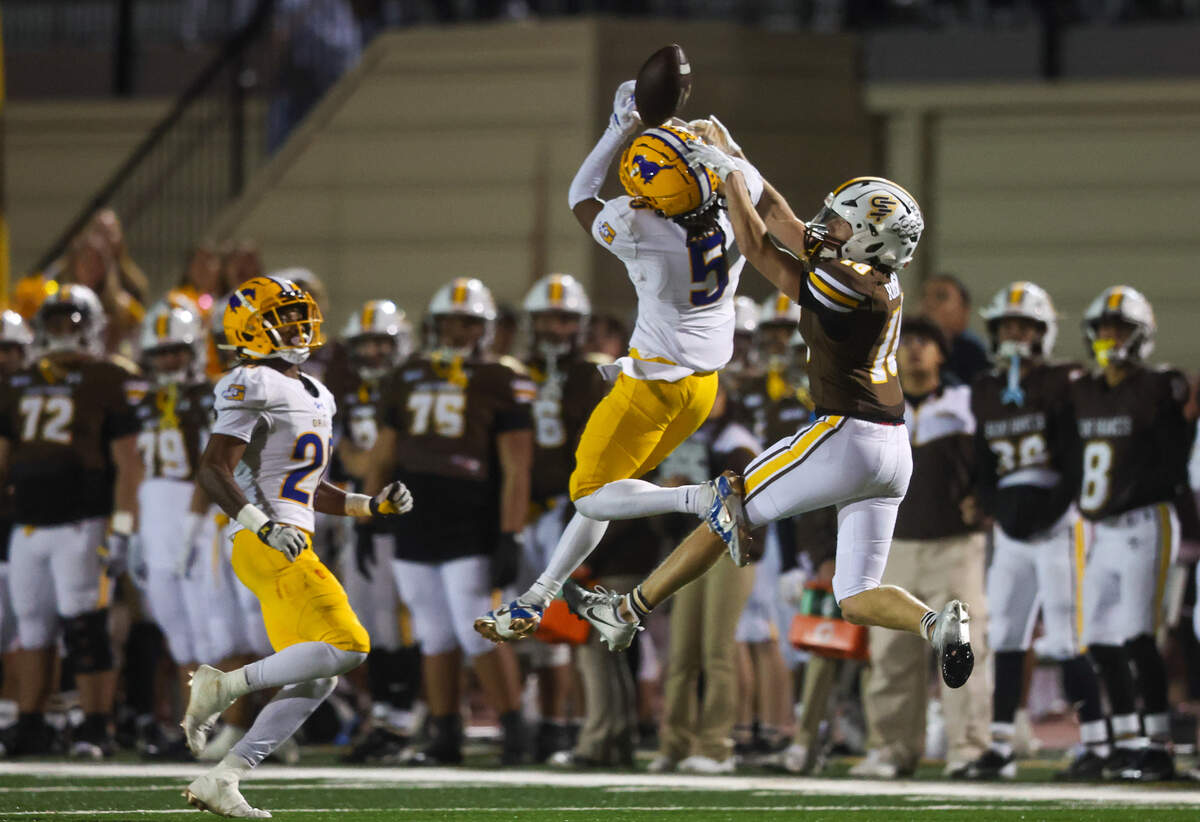 The Grant Pacers’ Tyron Carter breaks up a pass intended for St. Francis’ Grant Righellis (18) in the fourth quarter of the CIF Northern California Division 2-AA championship game on Friday.