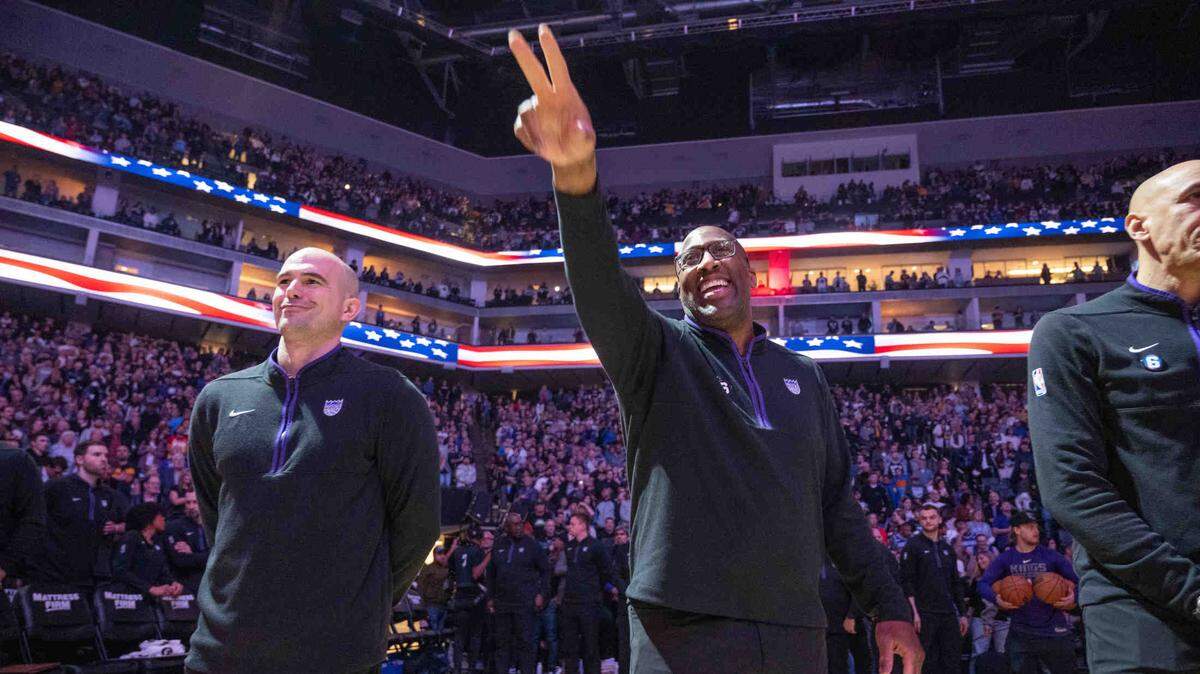 Mike Brown, Sacramento Kings head coach waves toward the bench of the Golden State Warriors during an NBA game on Friday, April, 7, 2023 at Golden 1 Center.
