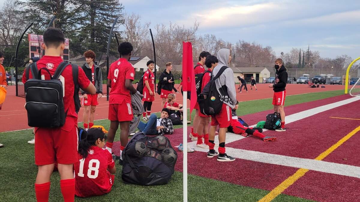 The McClatchy boys’ soccer team gathers after beating Grant 5-1 on Thursday, Jan. 13, 2022.
