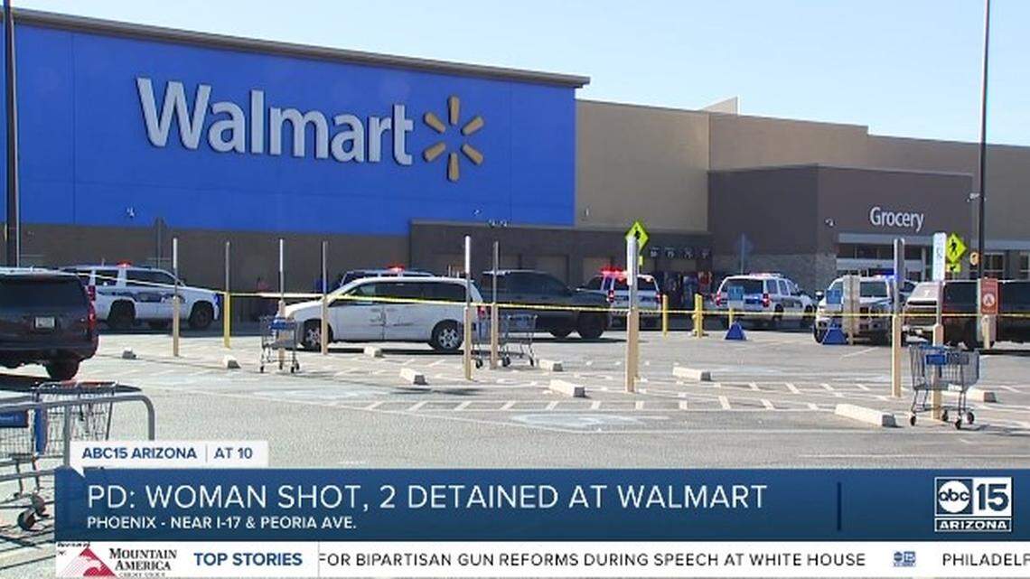 A gunman shooting at another man inside a Walmart store in Phoenix hit a bystander, wounding her, as shoppers fled, Arizona police say.