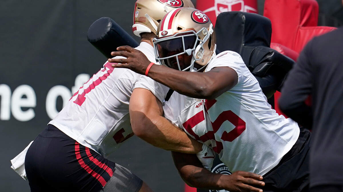 San Francisco defensive end Nick Bosa, left, works against defensive end Dee Ford during training camp on July 29, 2021.