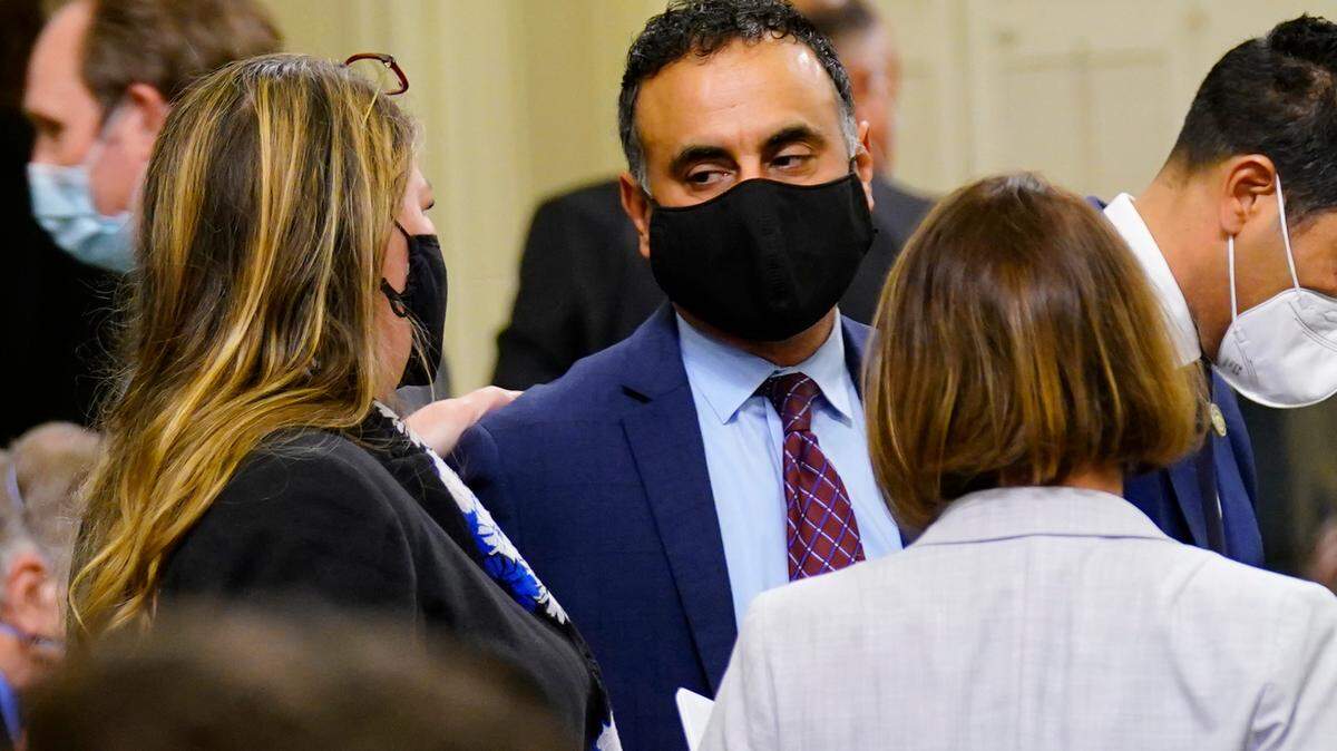 Assemblyman Ash Kalra, D-San Jose, center, talks with Assemblywomen, Tasha Boemer Horvath, D-Encinitas, left, Rebecca Bauer-Kahan, D-Orinda, right, after he did not bring his universal health care bill up for a vote during the Assembly session in Sacramento, Calif., Monday, Jan. 31, 2022. The bill had to pass by midnight Monday to have a chance at becoming law this year. But after intense pressure from business groups and the insurance industry, Kalra realized it would not pass and decided not to bring it up to a vote.