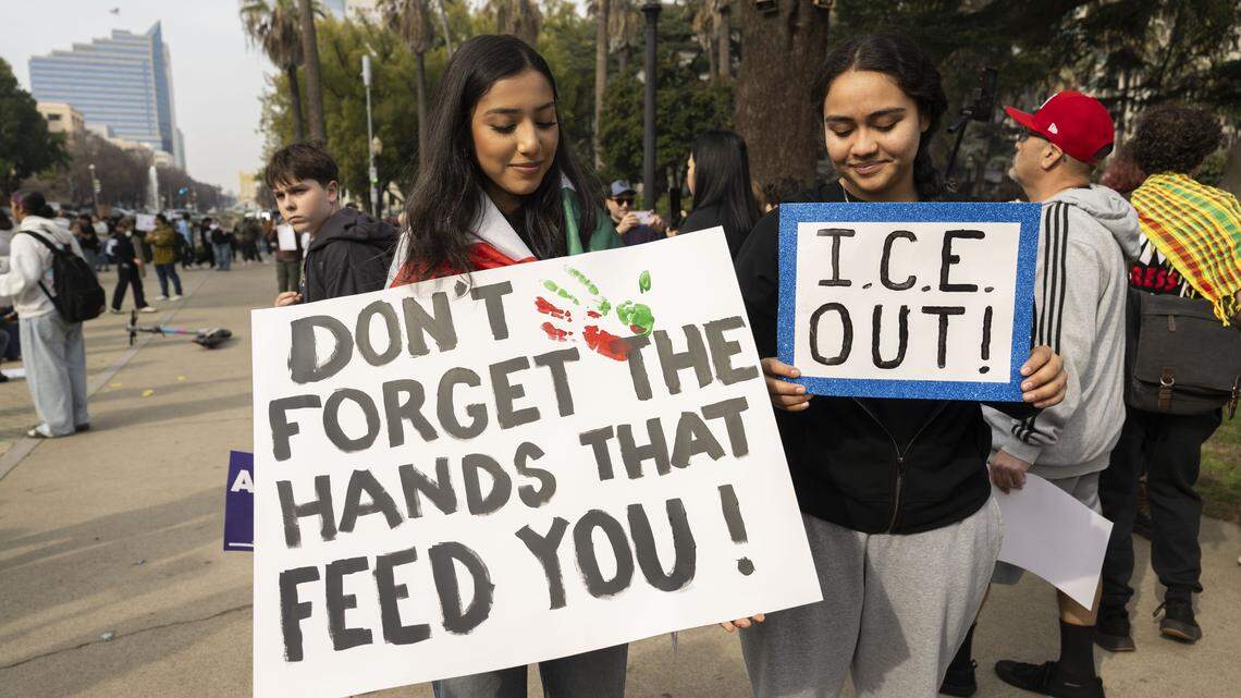 Burbank High School students Samantha Martinez and Mellisa Gonzalez hold signs during a student-led protest against ICE at the state Capitol in January. 