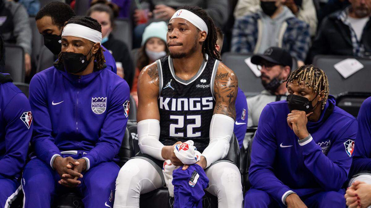 Sacramento Kings center Richaun Holmes (22), center, watches with teammates from the bench as the LA Clippers stay ahead of the Kings during the first half of the NBA basketball game Wednesday, Dec. 22, 2021, at Golden 1 Center in Sacramento.