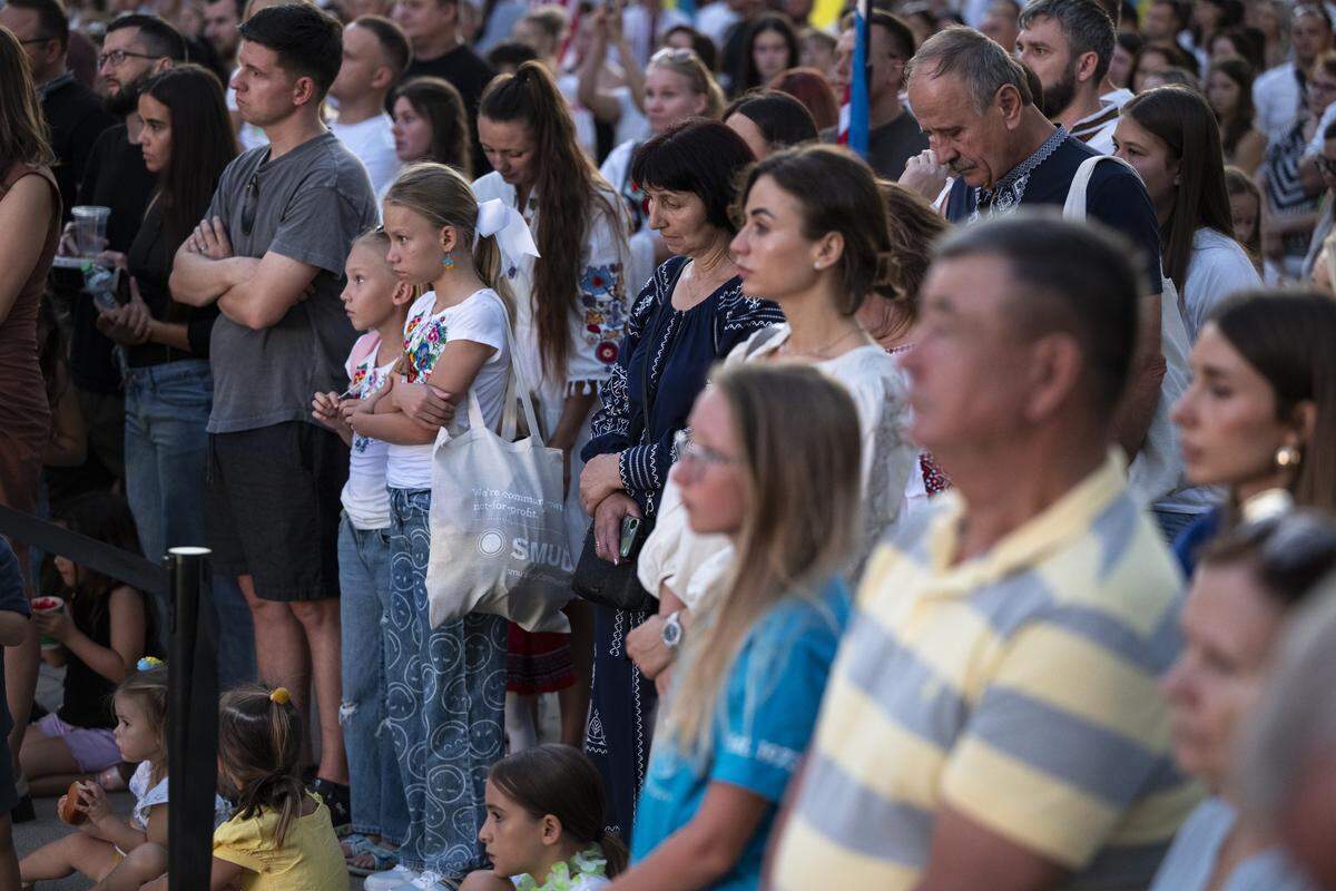 Ukrainian Americans react to a slideshow of recovering Ukrainian soldiers during a Ukrainian Independence Day celebration at the California Capitol in Sacramento on Sunday.