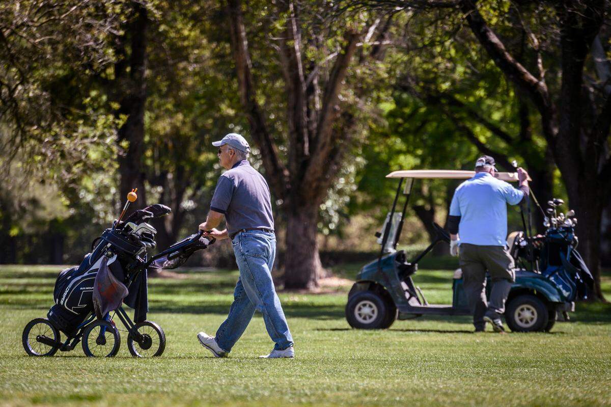 Golfers play the greens at Bing Mahoney Golf Course in Sacramento in April.