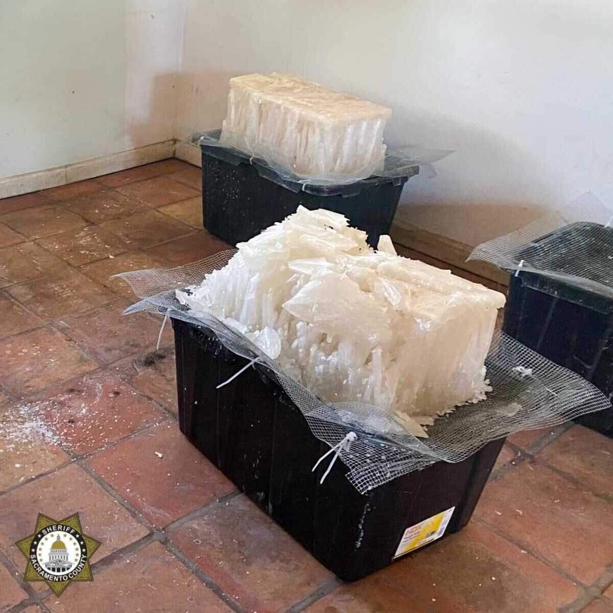 Investigators seized nearly 1,000 pounds of crystal methamphetamine headed to Sacramento County, 4,000 pounds of liquid meth still being processed in clandestine labs, 14 firearms and $50,000 in cash after serving search warrants on May 17, 2023, in Tulare County, California.