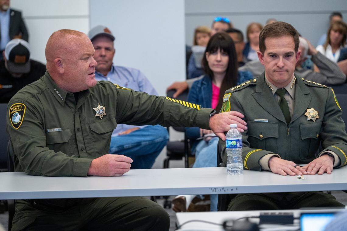 Glenn County Sheriff Justin Gibbs, left, and Siskiyou County Sheriff Jeremiah LaRue, right, make public comments about coyotes at a meeting of the Wildlife Resources Committee of the California Fish and Game Commission on Thursday.