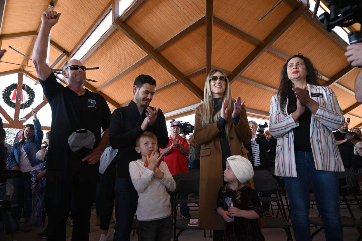 NASCAR champion and Elk Grove native Kyle Larson stands with his wife Katelyn and kids Owen and Audrey as he’s celebrated at the Old Town Plaza in Elk Grove on Monday, Nov. 22, 2021, with Brian Coulson, left, community event organizer and Bobbie Singh-Allen, Mayor of Elk Grove, right.