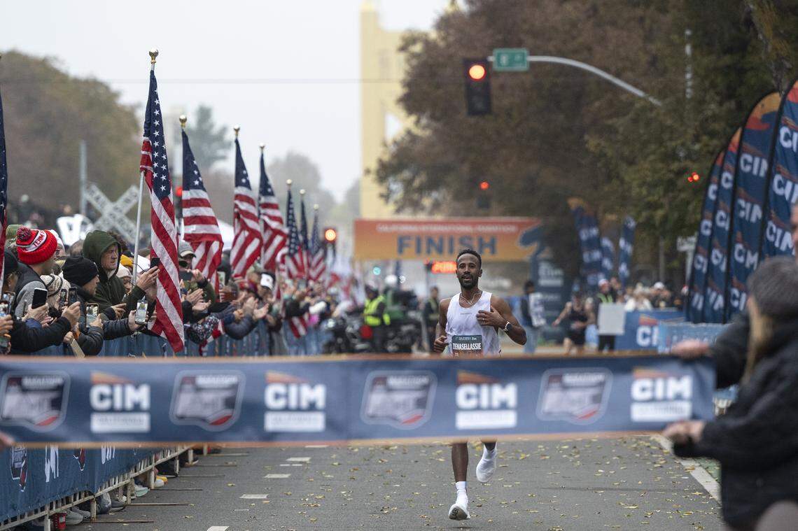 Futsum Zienasellassie crosses the finish line with a 2:09:29 time, winning the California International Marathon in Sacramento on Sunday, Dec. 7, 2025. Zienasellassie previously won the race in 2022 with a 2:11:01 time.