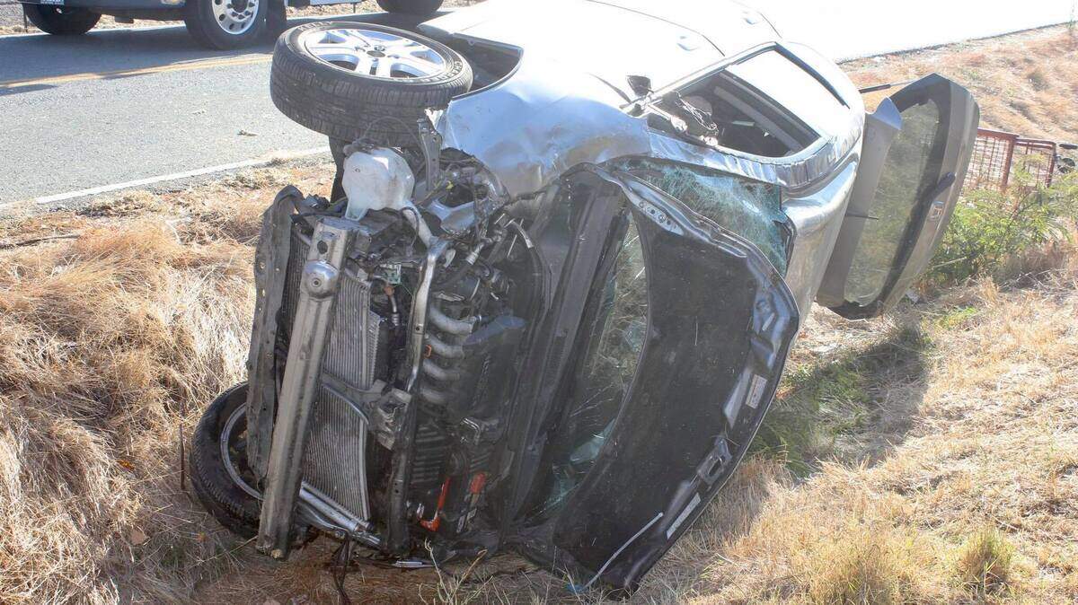 A Honda Fit is seen after it rolled over and through a a barbed-wire fence in Galt on Thursday, Nov. 7, 2019.