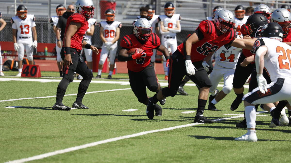 Antelope running back De’Magea Hogan (5) ran for 114 yards and had touchdown runs of two and five yards in the 21-14 win over Roseville on Saturday.