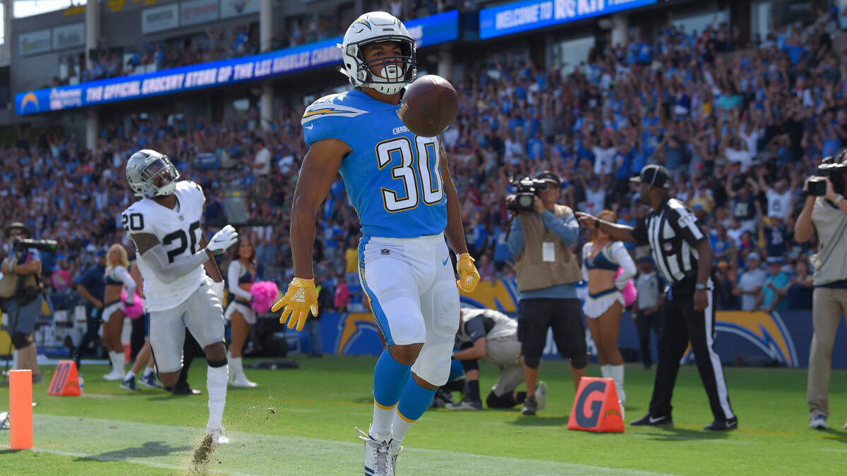 Los Angeles Chargers running back Austin Ekeler scores a touchdown against the Raiders on Sunday in Carson. Oakland is ranked 30th out of 32 NFL teams in total defense.