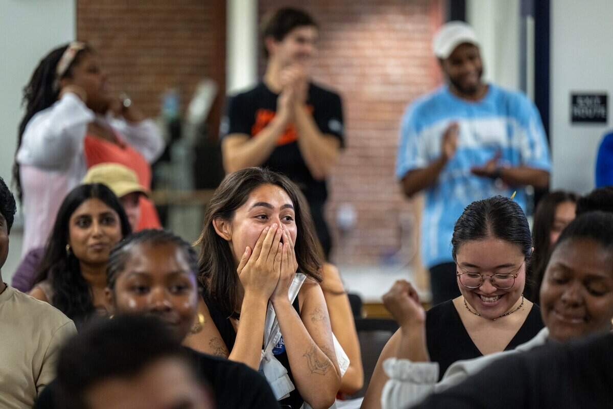 Xenia Vidal, center, reacts with other with others to a comment by former President Donald Trump during the watch party attended by Sacramento County Young Democrats at the California Federation of Teachers building in downtown Sacramento on Tuesday.