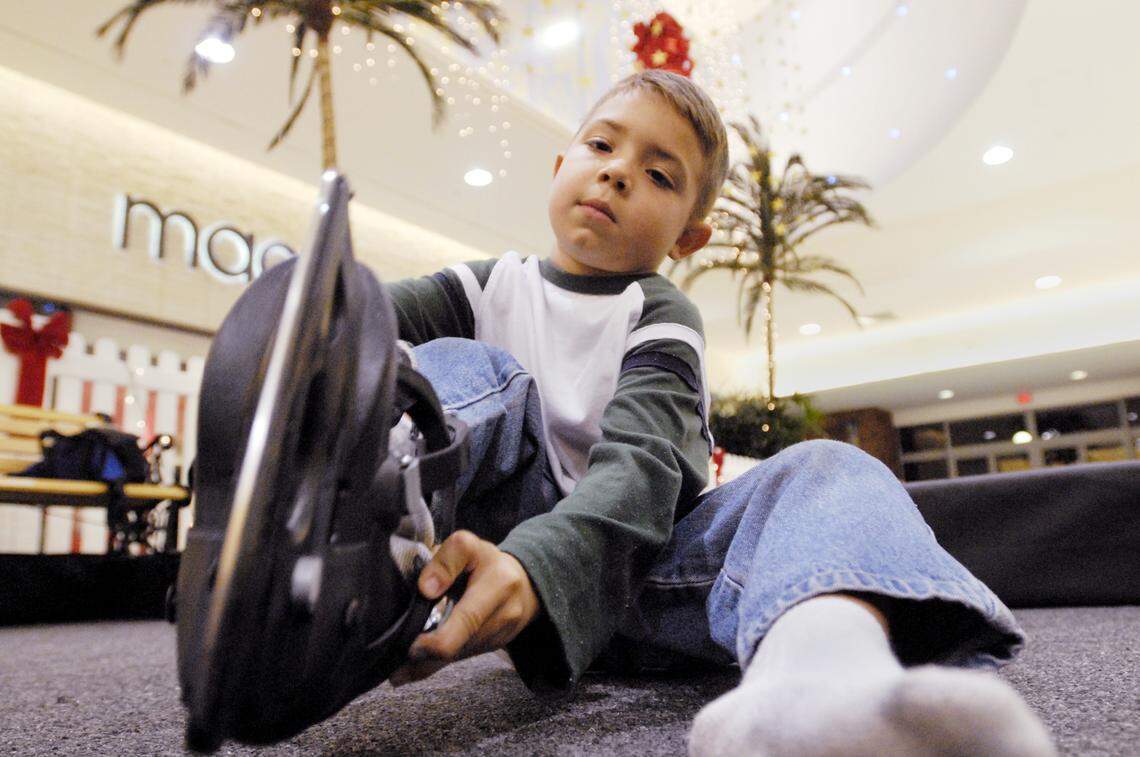 Jake Headington, 5, of Roseville, puts on his skates at the indoor skating rink inside of Sunrise Mall in 2006.