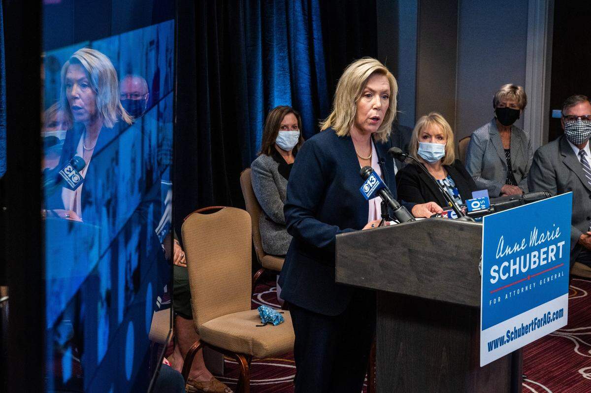 Sacramento County District Attorney Anne Marie Schubert’s face is reflected on a television showing virtual attendees at the announcement of her 2022 bid for California attorney general in 2021