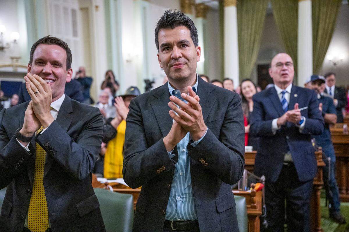 Rick Rivas, the brother of Assembly Speaker Robert Rivas, D-Hollister, claps for his brother after he took the oath of office at the state Capitol in 2023. 
