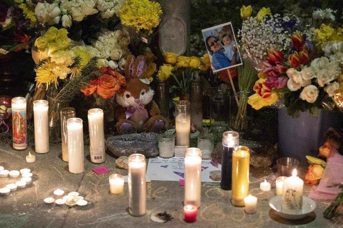 Candles outside the home of the Vallerga family during a vigil on Mill Water Circle in Rancho Cordova on Sunday to remember the family who were found dead inside on Jan. 27 in an apparent murder-suicide.