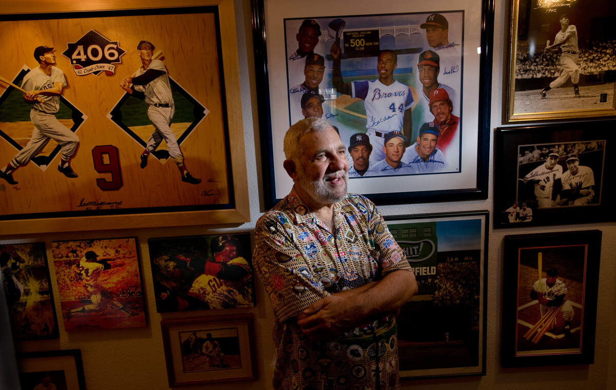 Former Sacramento Bee baseball reporter Nick Peters stands in the hallway of him home surrounded by baseball memorabilia on July 20, 2009, months after the announcement he would be included in the exhibits at Cooperstown.
