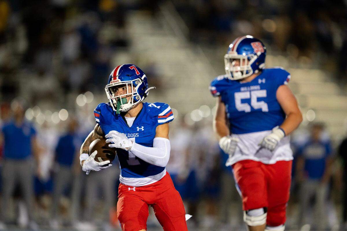 Folsom Bulldog running back Daymion Rivera, (7) runs into the end zone on the last play of the first half against the Serra Padres on Aug. 30, 2024, at Folsom High School. Folsom plays at Oak Ridge this Friday.