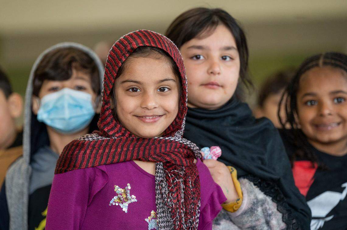 Sadaf Mamond stands in line with other Dyer-Kelly Elementary School students earlier this month during lunch time. The San Juan Unified School District has one of the largest immigrant communities from war-torn countries and is creating programs to help students with their transition to the United States.
