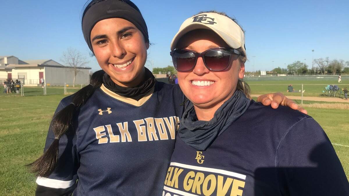 Elk Grove pitcher Aissa Silva poses for a picture with her coach, Amanda Buck.