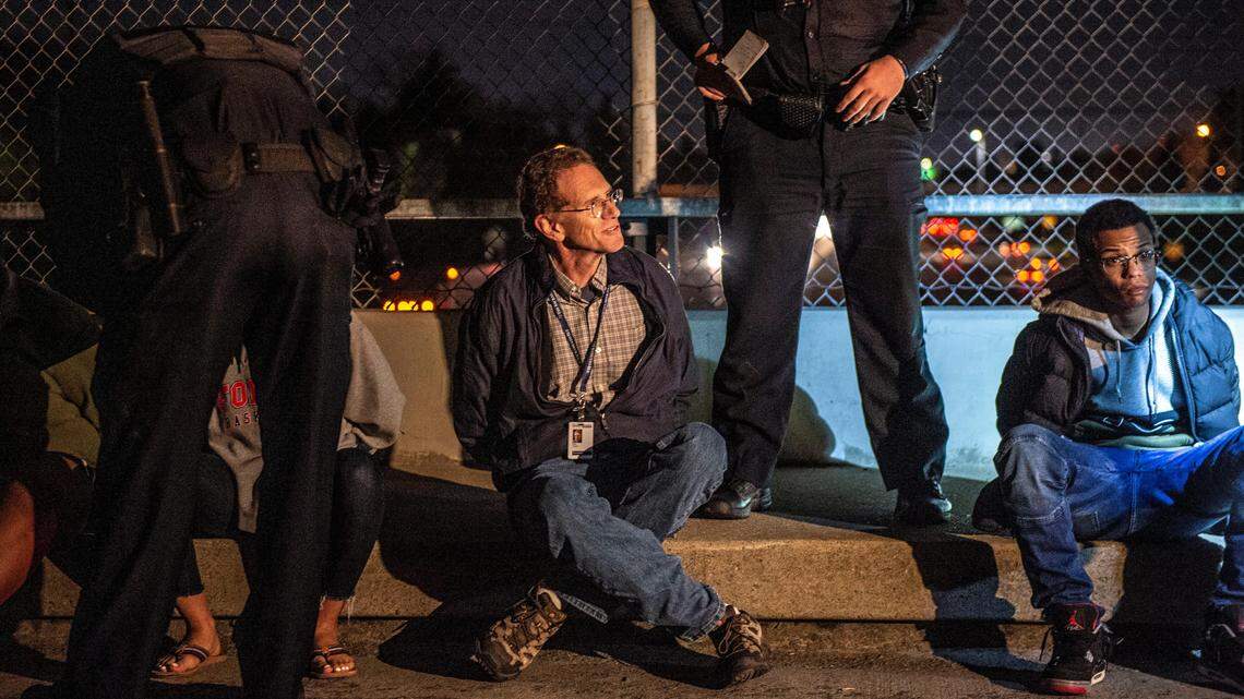 Sacramento Bee reporter Dale Kasler is detained by Sacramento police during a protest of the DA’s decision in the Stephon Clark case in East Sacramento on Monday, March 4, 2019.