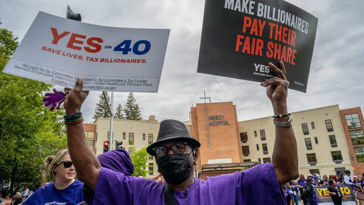 Hospital workers union rallies in East Sacramento in support of billionaire’s tax