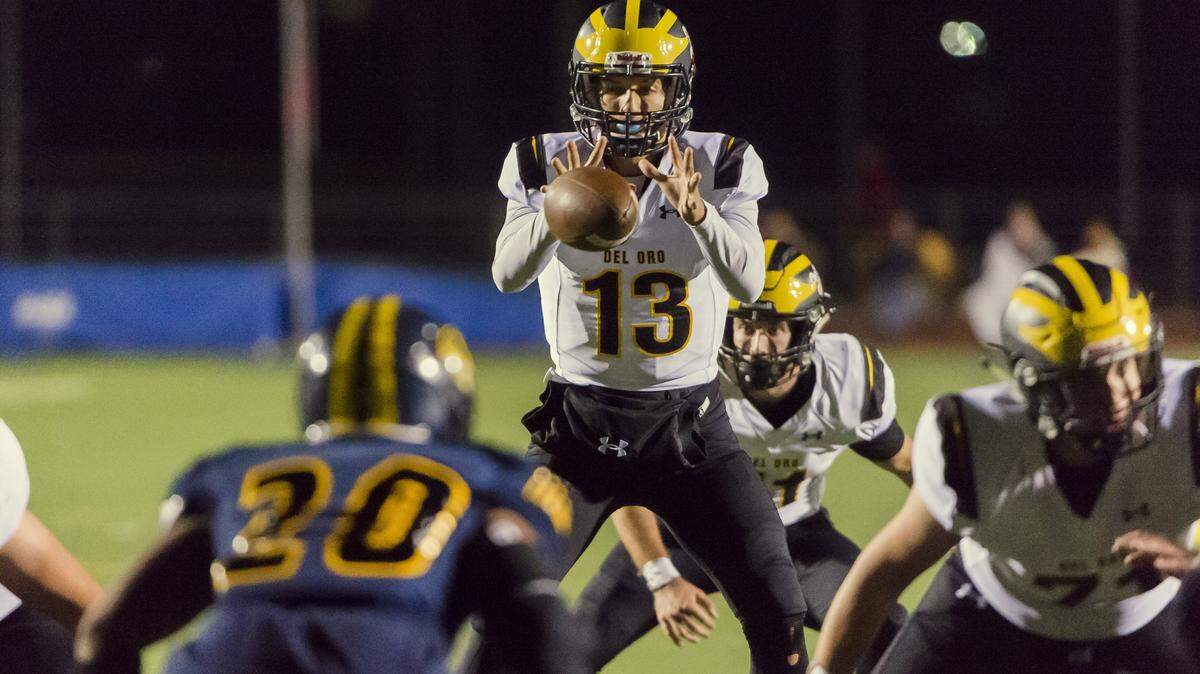 Del Oro’s Carson Jarratt takes a snap against the Inderkum Tigers in a Sac-Joaquin Section Division II second-round playoff game, Nov. 17, 2017.