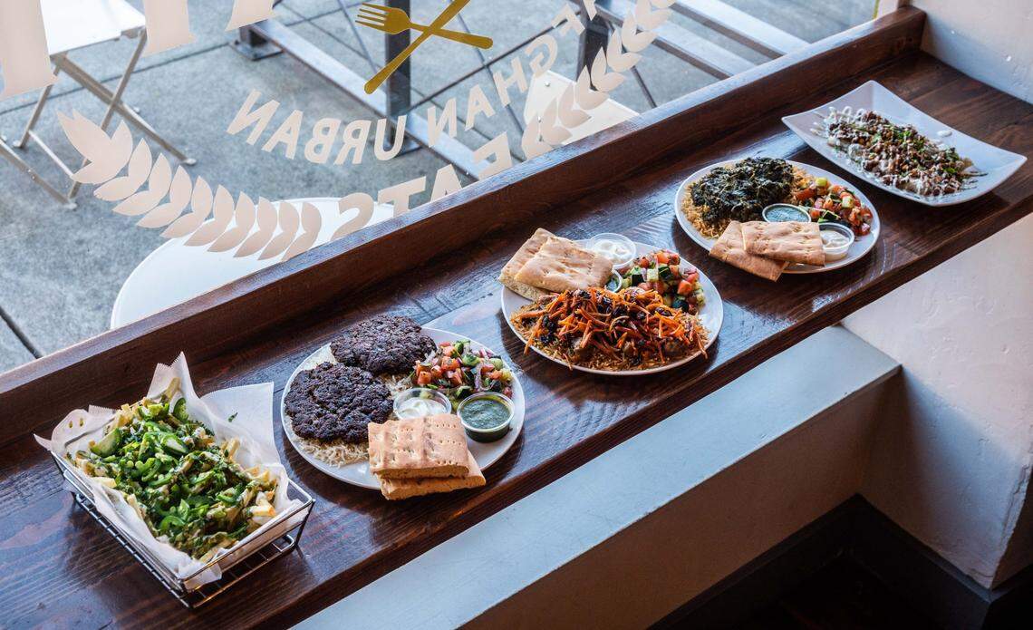 Plates of food sit on a table at House of Shah Afghan Urban Eats in Woodland on Wednesday, Feb. 24, 2021.