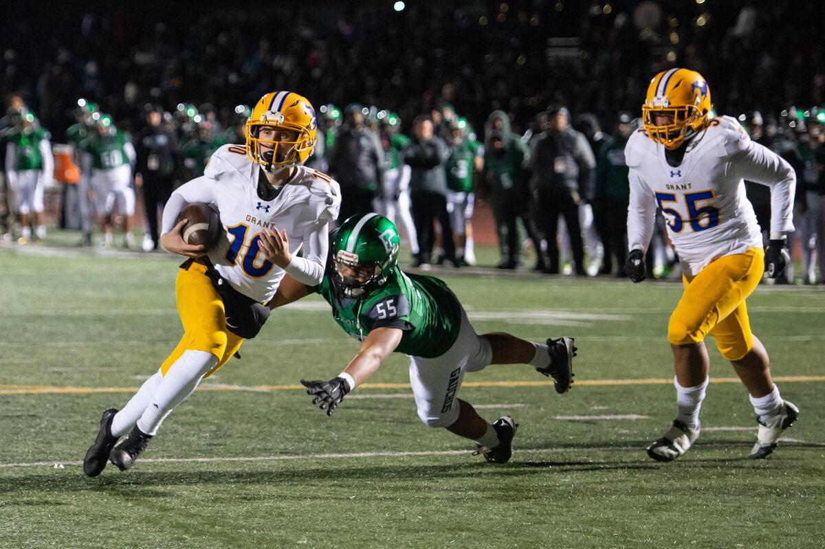 Grant Pacers quarterback Joseph McCray (10) runs the ball in for a touchdown past the El Cerrito Gauchos’ Sione Fanaika (55) during the second quarter in the CIF Northern California regional football championship game Friday, Dec. 2, 2022, at El Cerrito High School.