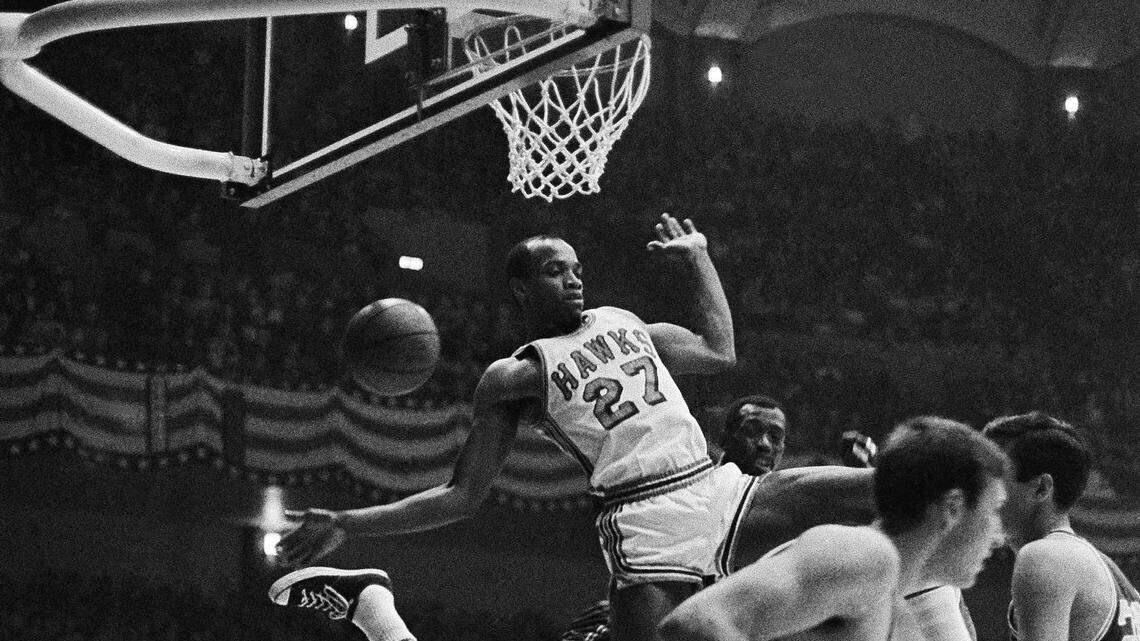 The St. Louis Hawks' Joe Caldwell (27) starts a descent after tipping in a rebound on Nov. 4, 1967, in St. Louis. Caldwell was selected second in the 1964 draft out of Arizona State, the 6-foot-5 guard/forward going to the Detroit Pistons. Now his grandson, Marvin Bagley III, has been selected in the 2018 NBA draft by the Sacramento Kings.