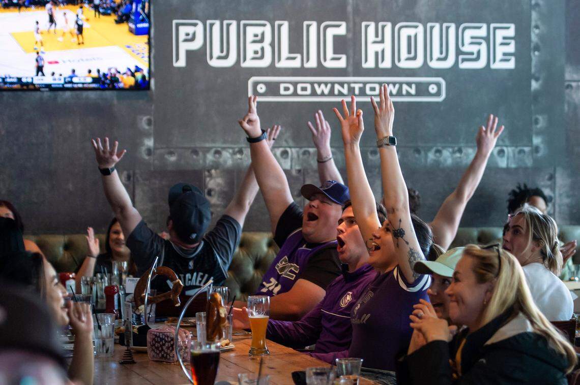 Sacramento Kings fans cheer as forward Keegan Murray makes a 3-pointer at the end of the first half on Sunday at Public House Downtown in Sacramento.