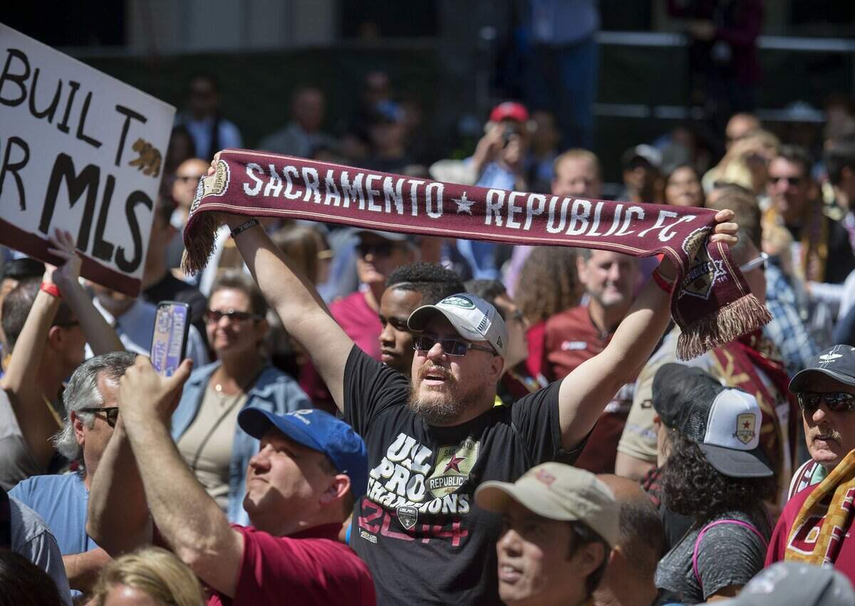 Jared Slaff, who was born and raised in Sacramento but now lives in Phoenix, holds up his Republic FC scarf during a ‘block party’ April 14, 2016 in Sacramento. The city is still hoping to be awarded an MLS franchise.
