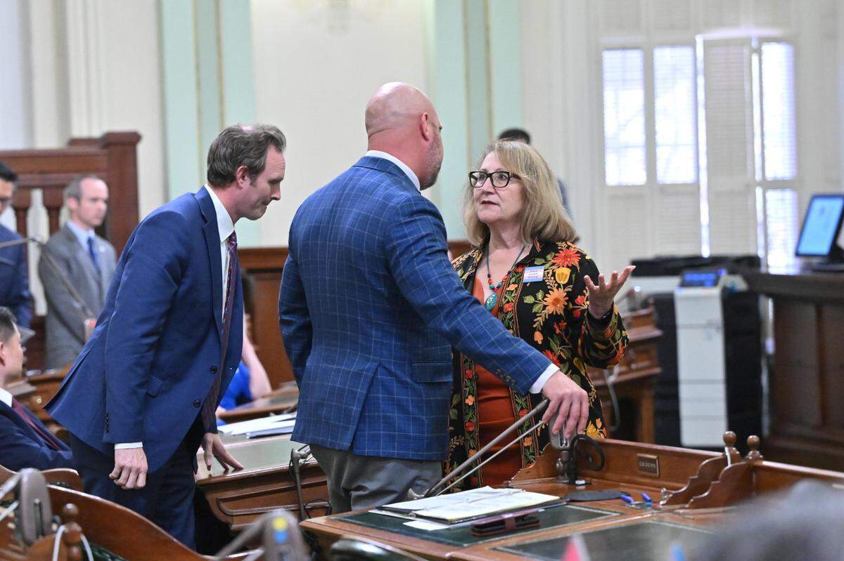 Assemblymember Heath Flora, R-Ripon, and Majority Leader Eloise Gomez Reyes, D-Colton, discuss Assembly rules after Republicans attempted to introduce a gas tax bill during debate on a bill to penalize oil companies for alleged gas price gouging in 2023. 