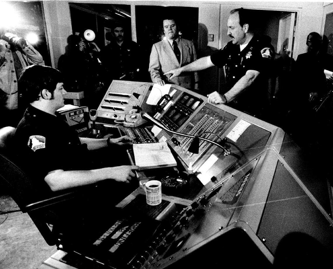 Sheriff’s deputy Brian Arbuckle, left, sits in the master control room of the Sacramento County jail with Sheriff Duane Lowe, center, and Capt. Braxton Bonner, right, on Jan. 26, 1978.