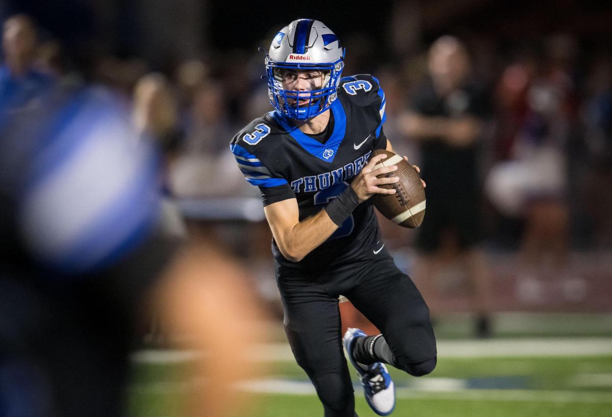 Rocklin Thunder quarterback Reeve Slone (3) scrambles and tries to avoid the Folsom Bulldogs defense on Oct. 6.