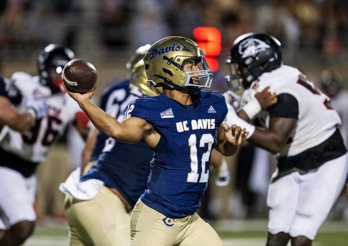 UC Davis Aggies quarterback Caden Pinnick (12) throws a pass in the second half against the Southern Utah Thunderbirds on Saturday, Sept. 20, 2025 in Davis.