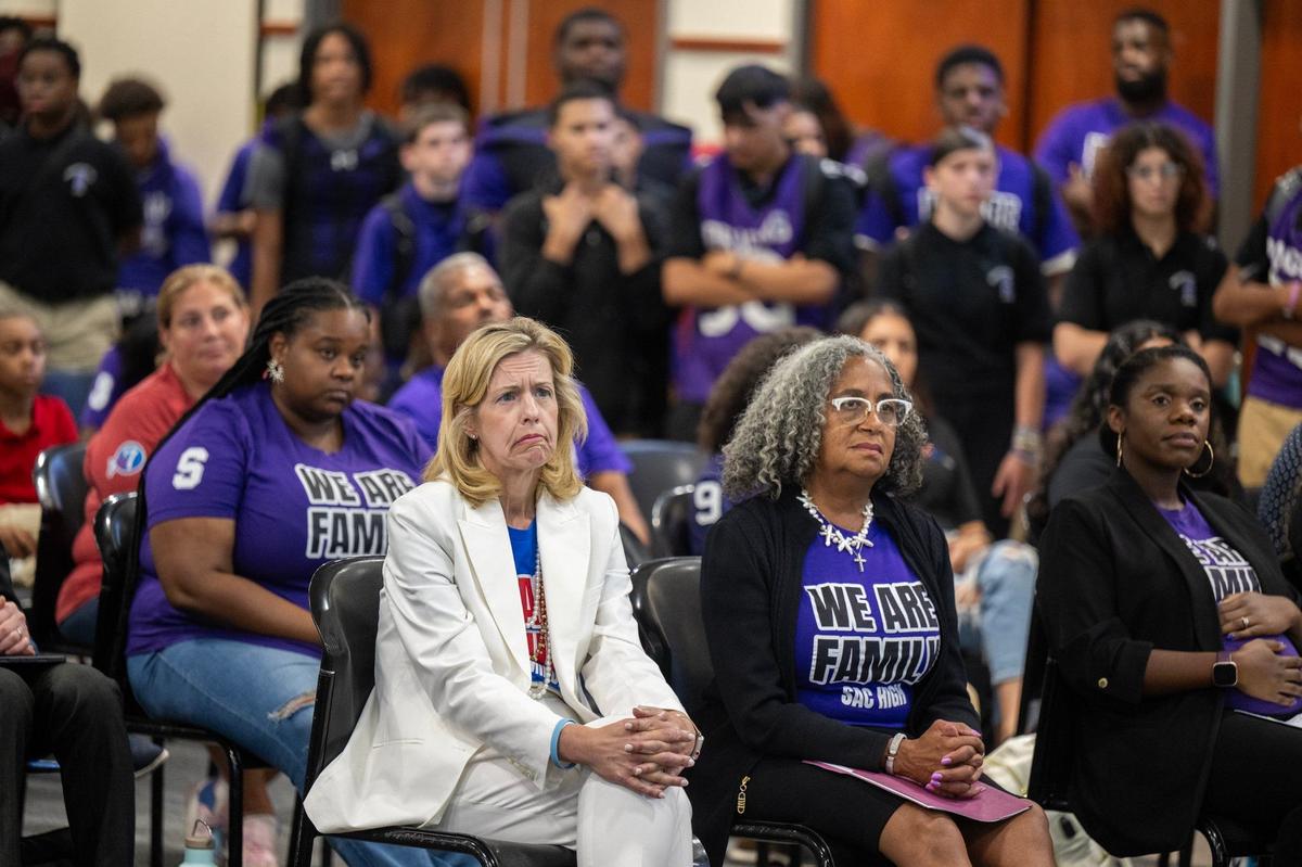 St. Hope Public Schools superintendent Lisa Ruda, left, and Cassandra Jennings, CEO of both St. Hope Academy and St. Hope Development Center, right, listen to speakers at the Sacramento City Unified school board meeting on Thursday, Aug. 8, 2024.