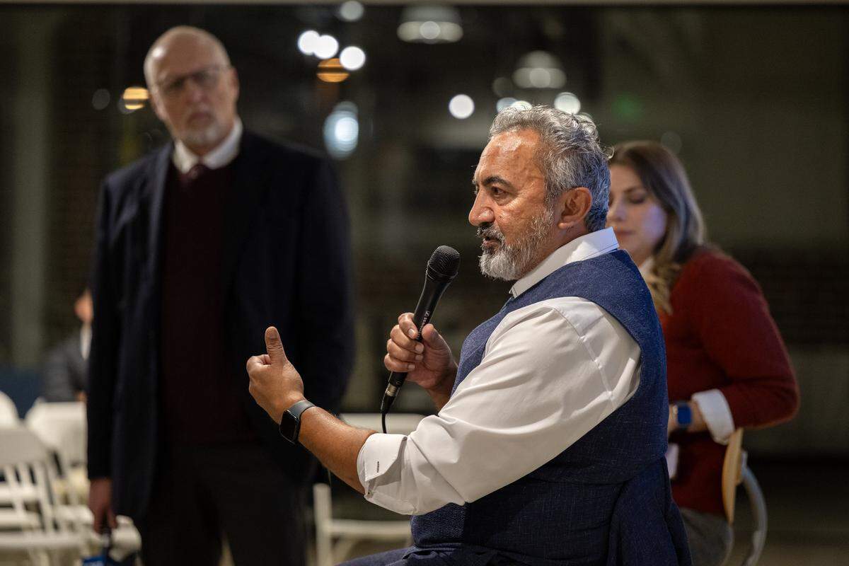 Rep. Ami Bera, D-Elk Grove, joined by Sacramento Bee opinion editor Marcos Breton and politics reporter Nicole Nixon, answers a question at a town hall meeting with Bee subscribers on Thursday in The Bee's newsroom.