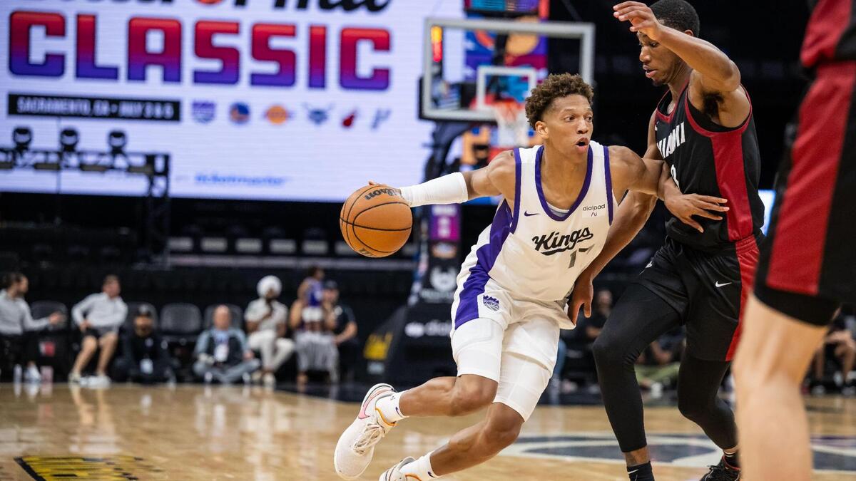 Sacramento Kings forward Kessler Edwards (17) dribbles against Miami Heat forward Jamal Cain (8) during the second half of their California Classic NBA summer league basketball game Wednesday, July 5, 2023, at Golden 1 Center.